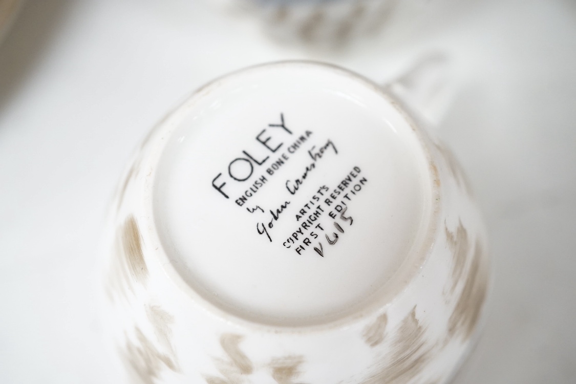 A Foley ‘fish’ part teaset by John Armstrong together with eleven plates designed for Clarice Cliff. Condition - varies